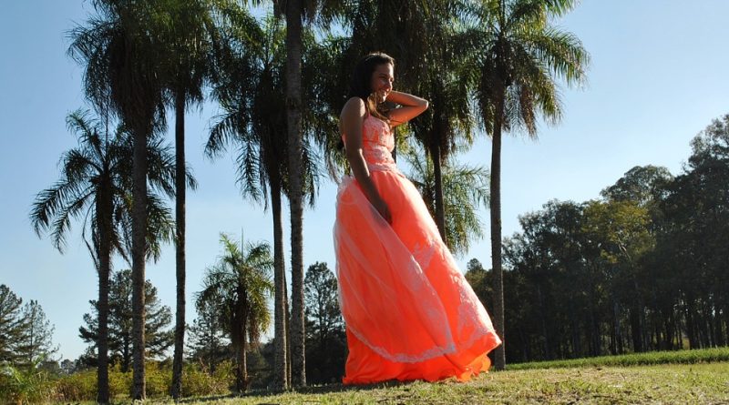 Help Your Daughter Prepare For Her Prom Teen in orange prom dress