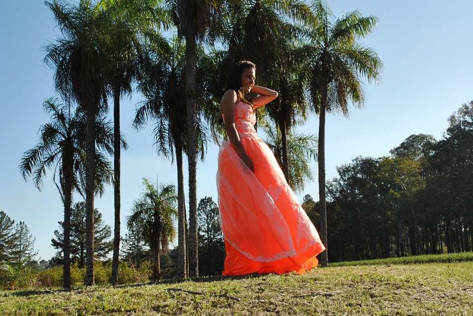 Help Your Daughter Prepare For Her Prom Teen in orange prom dress
