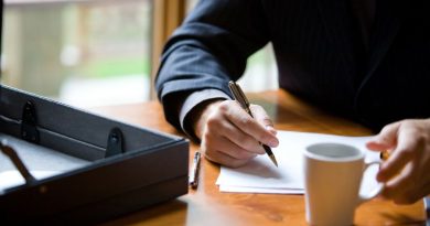 Man writing on a pad of paper Writing a Will