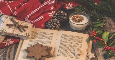 Open Book on Table with Christmas Decorations
