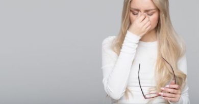 Reasons Your Glasses Don't Fit Right / Woman Holding her nose where he glasses had been sitting