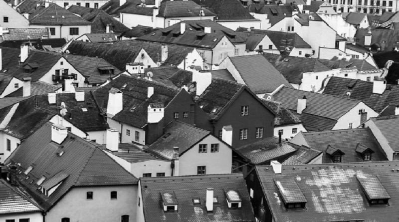 Why Is Your Home Getting So Cold / Black and White photo of homes with dark roofs.