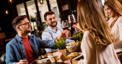 Couples toasting with their wine glasses at a nice restaurant