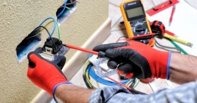 A Dedicated Circuit / Electrician installing an outlet in home wall