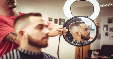 Man looking in the mirror at a barber shop