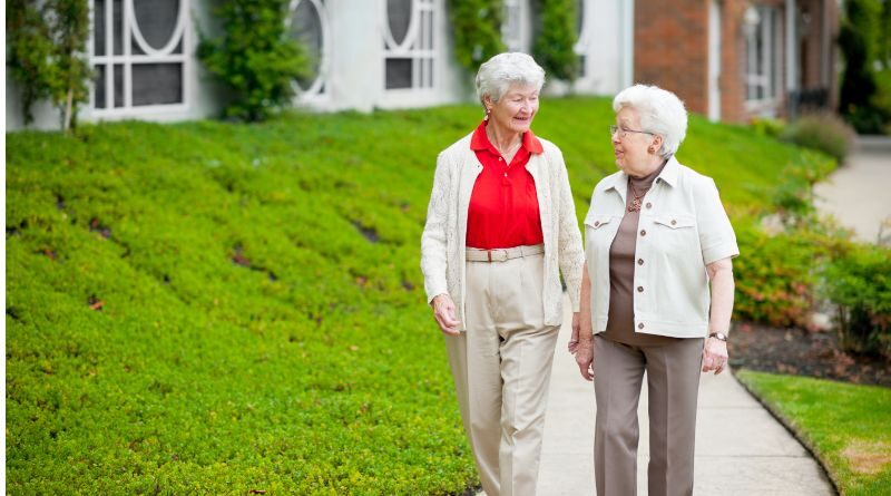 Two Friends walking together through a retirement community