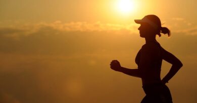 Motivate Yourself to Exercise / Woman running as the sun comes up