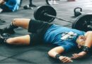 Healthy Ways to Burn Fat and Build Muscle / Exhausted man laying on the floor at the gym