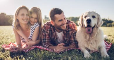 Happy family outside with their dog