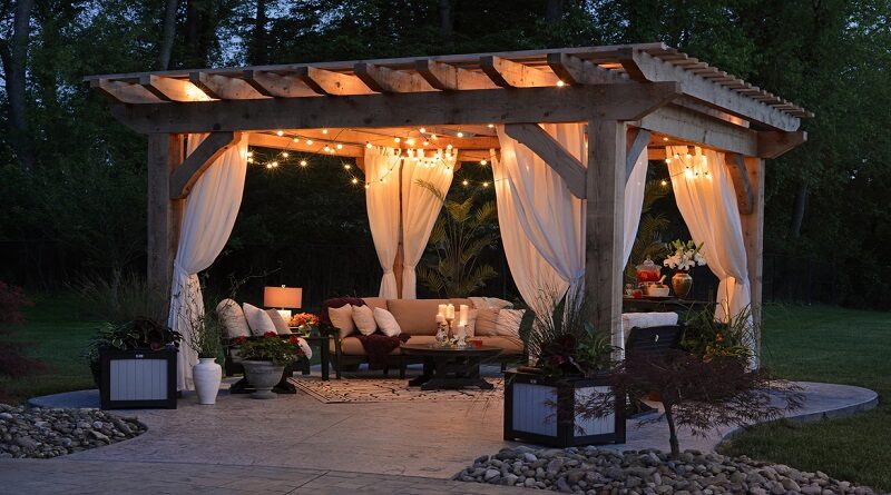Backyard Ideas to Create a Perfect Outdoor Paradise / Beautiful lighted backyard pergola with outdoor furniture and potted plants