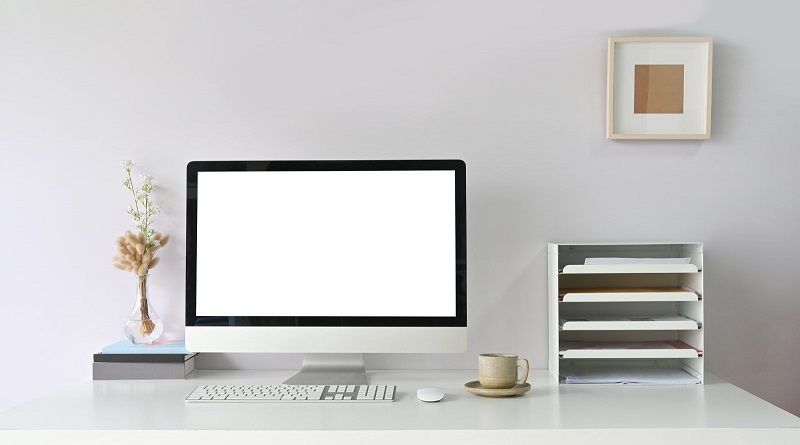 Make Work More Enjoyable With This Step-by-Step Guide / A clean and orderly desk with Mac, and simple filing storage
