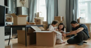 Set Up Your New Home / A man woman and child with packing boxes in an apartment