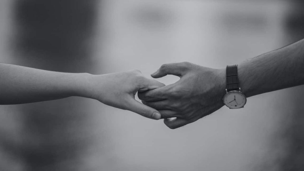 8 Ways You Know It’s Time to Divorce / Black and White photo of man and woman's hands together
