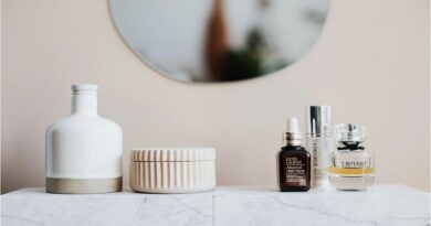 Create a Healthy Self-Care Routine / Marble counter top with bottles and jars of lotions and potions