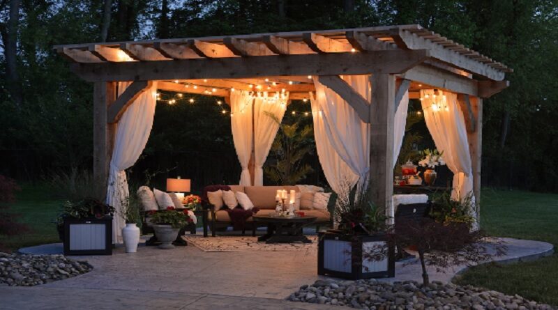 Make Sure Your Outside Space is Party Ready / Pergola with Curtains and Lights and lovely furniture