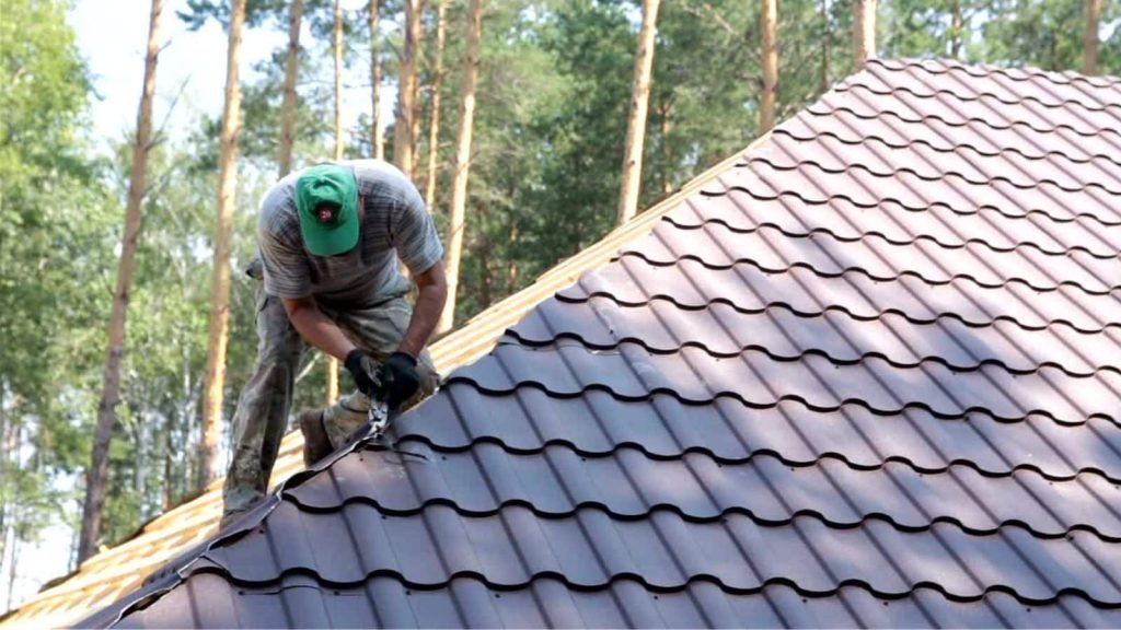 Roofer working on roof top