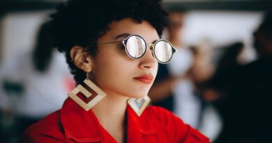 Jewelry With A Difference: 7 Unique Jewelry Gift Ideas / Beautiful Black Women with large glasses and earrings wearing deep red