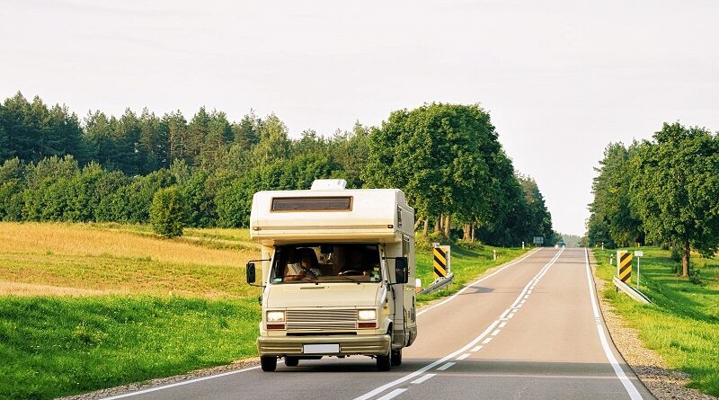 Why Campervans Make the Most Sense on Your Next Family Road Trip / Campervan driving down a 2 lane road