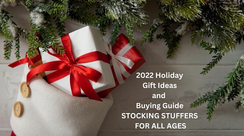 2022 Holiday Gift Idea and Buying Guide - STOCKING STUFFERS FOR ALL AGES / Stocking Filled with gifts hanging from a mantel trimmed in Christmas Greenery