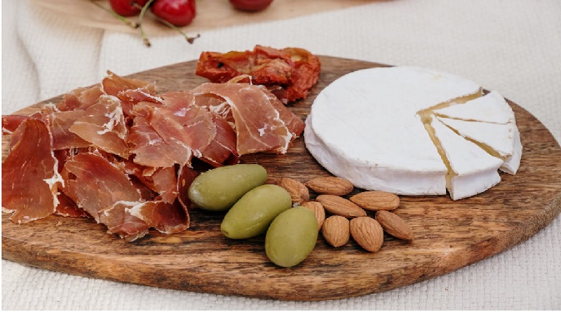 Sliced Prosciutto  Olives Almonds and Camembert Cheese / Some Of The Best Cheese Recipes To Try