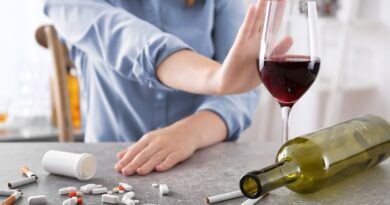 What to Expect from Substance Use Disorder Treatment? / Drugs., Alcohol, and Cigarettes' on a table and a woman holding her out out as to say no