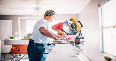 2 men working with power tools doing home renovations