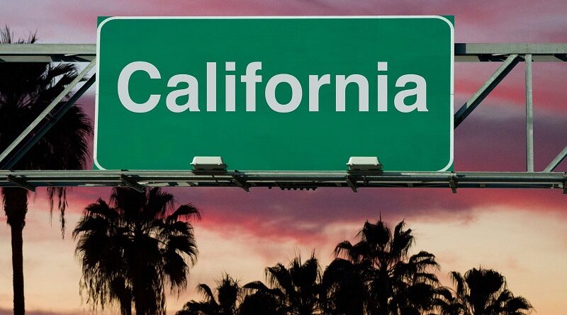 Santa Rosa / California Road Sign backed by palm trees and a sunset