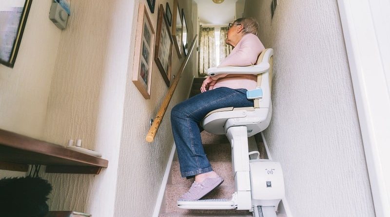 Different Types of Stairlifts / Woman ascending a stair case in a stair lift seat