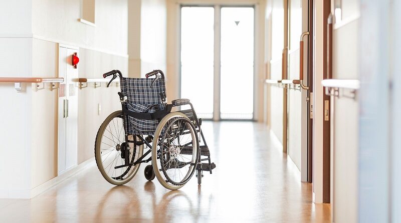 Empty Wheelchair in the Hallway of a Nursing Home / The Role of Nurses in Preventing Nursing Home Abuse: Responsibilities and Best Practices