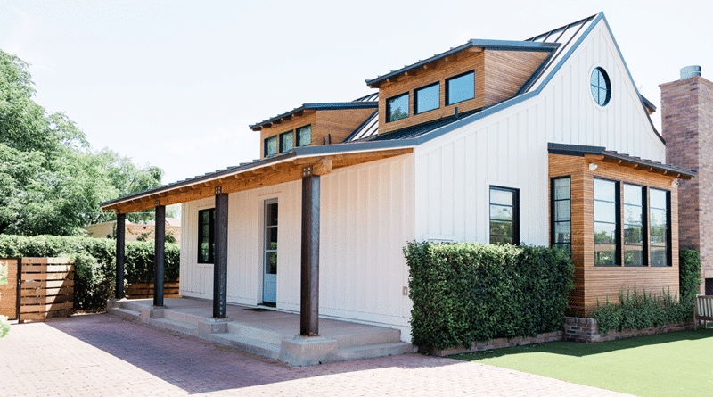 Exterior of White Home with Natural Wood Trim / Top 6 Essential Home Improvement Tips for Timeless enhancements