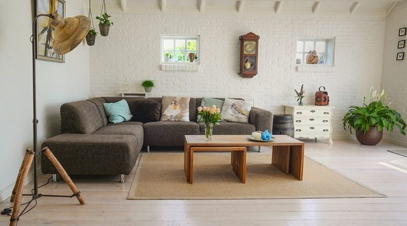 Living Room in Neutral Colors with Sofa, Stacking Coffee Tables, Rug, Lamps and Plant / The Things To Think About When It Comes To A Home Project