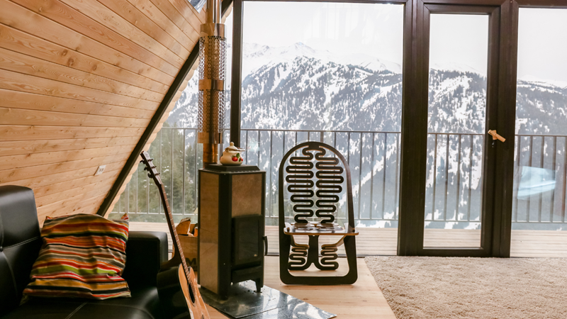 Ski Resort Rustic Room with a Beautiful View Overlooking Snow Covered Mountains