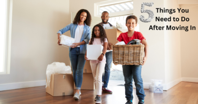 Young family bringing boxes into their new home / 5 Things You Need to Do After Moving In