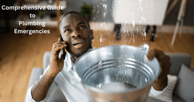 Man holding a bucket under a leak in his ceiling while talking on his cell phone / Comprehensive Guide to Plumbing Emergencies: From Detection to Repair