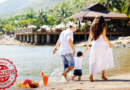 Couple with a Child Walking on a Beach Together / The Ultimate Guide to All-Inclusive Resorts: What to Expect and How to Choose the Perfect One