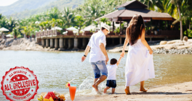 Couple with a Child Walking on a Beach Together / The Ultimate Guide to All-Inclusive Resorts: What to Expect and How to Choose the Perfect One
