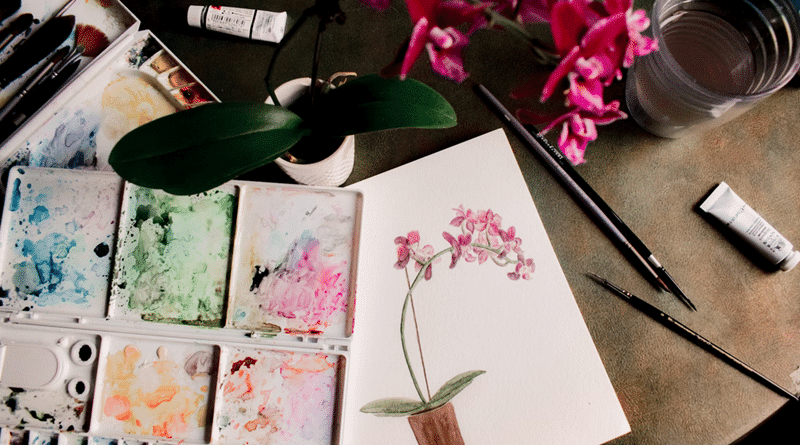 Watercolor painting of pink and white flowers with watercolor paints and brushes. / How To Enjoy Your Hobbies More