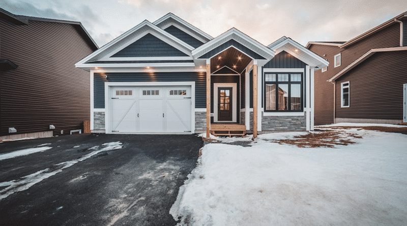 Grey and White Home with porch and under eves lighting / Front Yard Lighting: What to Pick