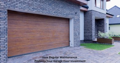 Home with White Stucco Grey Bricks and Wood Grain Garage Door / How Regular Maintenance Protects Your Garage Door Investment