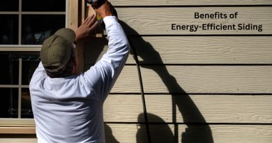 Man installing siding on a home / Benefits of Energy-Efficient Siding