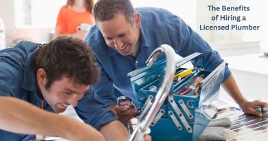 Two Plumbers Working on a Kitchen Faucet / The Benefits of Hiring a Licensed Plumber: What You Need to Know