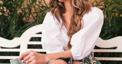 Woman on White Bench Wearing a White Blouse and Botanical Patterned Skirt / Top Trends: The Must-Have Going Out Tops for This Season