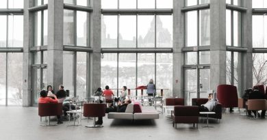 Large Open Concept People in Office Open Concept Area Gray with Red Accents Large Window / The Way Your Business Office Looks Is Important, You Know?