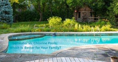 Backyard pool with a wooden and a playhouse house and trees / Saltwater vs. Chlorine Pools: Which Is Better for Your Family?